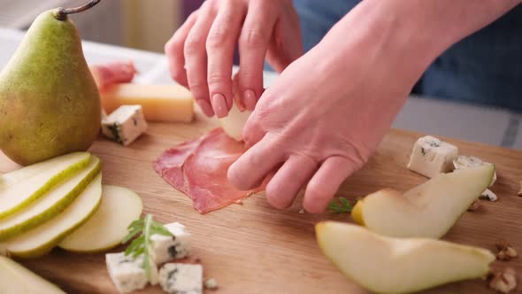 Making Pear and Blue Cheese Salad  Slices of Jamon