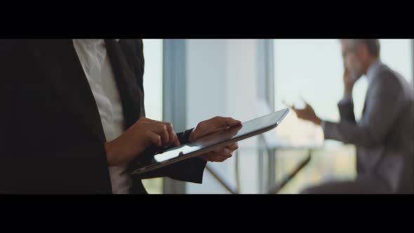 Woman using tablet for work