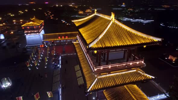 Night Aerial Shoot of the Chinese Pagoda By the Water Illuminated By Bright Neon Lights