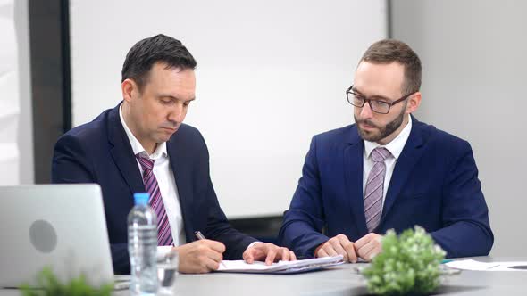 Two Business Male in Suit Sign Contract Agreement Making Deal at Office