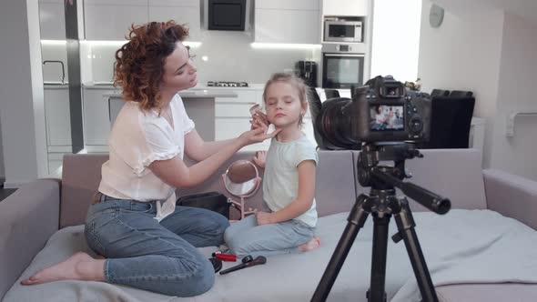 Backstage of Photoshoot of Mother Doing Makeup for Daughter at Home