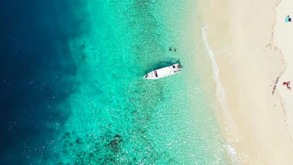 Aerial above panorama of exotic coast beach lifestyle by turquoise sea with white sand background of