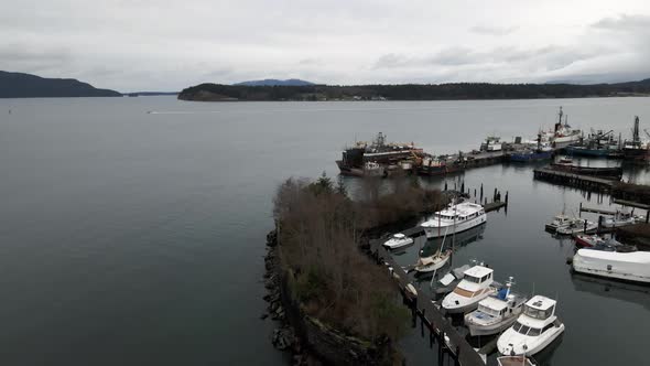 Passing over the derelict ship La Merced, Anacortes, Washington, dark storm clouds, aerial