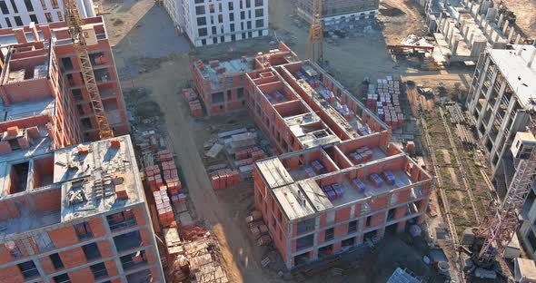 Large Construction Site with Busy Tower Cranes at Highrise Building