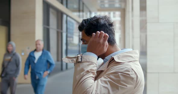 Side View of Businessman Put on Safety Mask and Enter Business Center