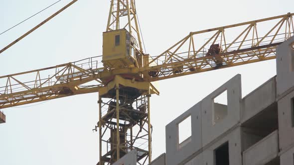 Yellow Crane on the Construction Moving to the Right