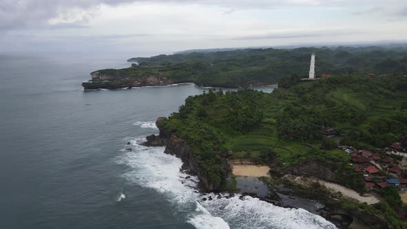 Aerial view of the lighthouse in Indonesian beach