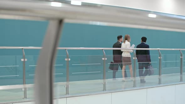 Office Workers Walking Through the Corridor