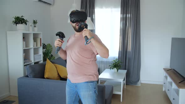 Young Man Wear Casual Clothes Watching in Vr Headset