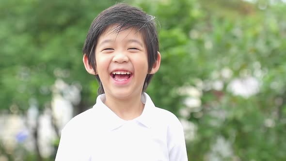 Close Up Of Happy Asian Child Outdoor Slow Motion