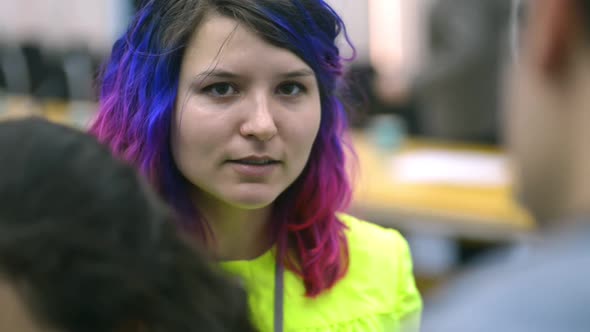 Portrait of Young Pretty Girl is Talking to Guy During Learning Day at University Irrl