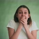 Woman with Tears in Eyes Screams Loudly with Fear on Green - VideoHive Item for Sale