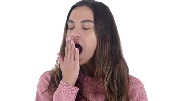 Tired Young Latin Woman Yawning at Work White Background