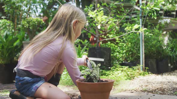 Little girl gardening in a nature