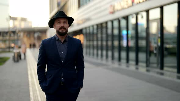 Attractive and Elegant Dressed Man is Walking Alone on City Street in Daytime Confident Guy