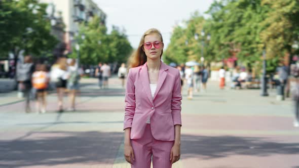 Zoomout Time Lapse of Beautiful Girl Standing Outside in Pedestrian Street on Sunny Day