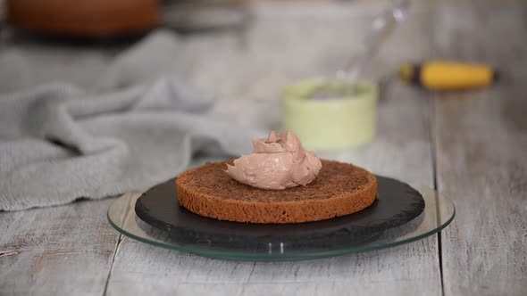 Woman Is Preparing Chocolate Cake with Cream