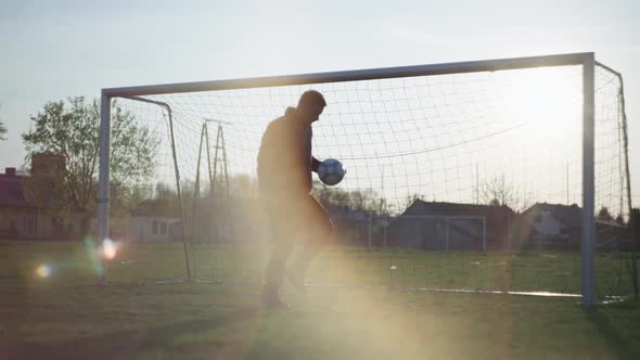 The Guy Stuffs the Ball at the Football Goal