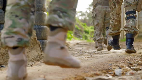 Low section of military soldiers walking during military training 4k