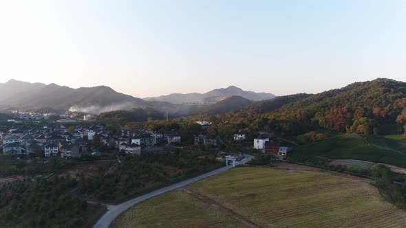 Mountain village and farmland in the sunset