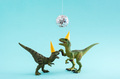 Two cute green dinosaurs dancing under disco ball. Funny idea for birthday card on blue background. - PhotoDune Item for Sale