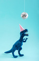 Cute blue dinosaur dancing under disco ball. Funny idea for birthday card on blue background. - PhotoDune Item for Sale