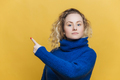 blonde young woman with curly blonde hair dressed in bright blue sweater - PhotoDune Item for Sale