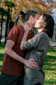 Candid lifestyle portrait of two happy young people hugging each other in autumn park. - PhotoDune Item for Sale
