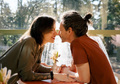 Young man and woman flirting while sitting in a cafe on a warm sunny day. - PhotoDune Item for Sale
