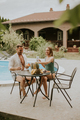 Young couple sitting in the backyard - PhotoDune Item for Sale