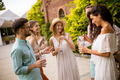 A group of young people gather outdoors to enjoy each other's company - PhotoDune Item for Sale