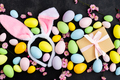 Stylish background with colorful easter eggs on dark concrete background with blooming branches - PhotoDune Item for Sale