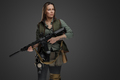 Female mercenary with rifle isolated on grey background - PhotoDune Item for Sale