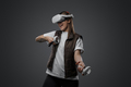 Excited woman enjoying innovative headset of virtual reality - PhotoDune Item for Sale