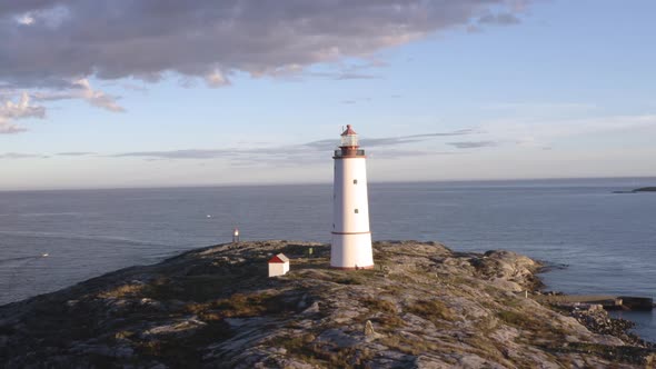 Lille Torungen Lighthouse And The Tranquil Sea In Arendal, Norway - aerial drone shot