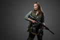 Female mercenary with rifle isolated on grey background - PhotoDune Item for Sale