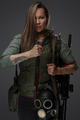 Determined female killer with huge knife and rifle - PhotoDune Item for Sale