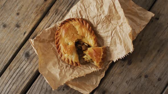 Video of pie seen from above on wooden background