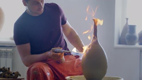 Experienced Potter Creating a Beautiful Clay Vase Using Professional Tools