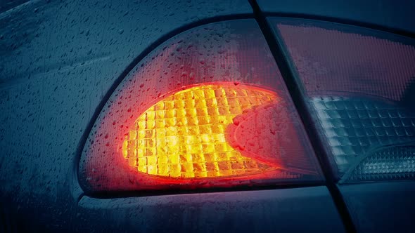 Car Light Flashing In The Rain