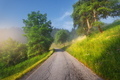 Rural empty road in mountains in summer foggy morning - PhotoDune Item for Sale