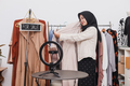 Young Asian muslim woman selling clothes online on social media - PhotoDune Item for Sale