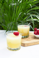 Refreshing cold melon drink with ice and lime slices, garnished with raspberries  - PhotoDune Item for Sale
