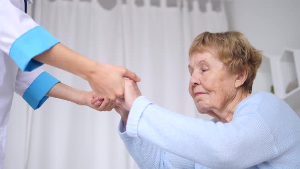 Senior Woman With Her Caregiver At Home