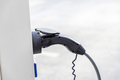 charger plug to an electric vehicle from charging station. - PhotoDune Item for Sale