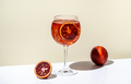Rosso tonic alcoholic cocktail drink with red vermouth, tonic, orange and ice in wine glass - PhotoDune Item for Sale