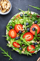 Strawberry and herbs healthy salad with arugula, blueberries and walnuts, black kitchen table - PhotoDune Item for Sale