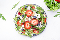 Strawberry and herbs healthy salad with arugula, blueberries, soft white feta cheese and walnuts - PhotoDune Item for Sale