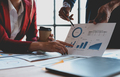 Business people meeting to plan, analyze and point to graph and chart about business growth to plan  - PhotoDune Item for Sale