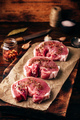 Raw pork loin steaks with different spices - PhotoDune Item for Sale